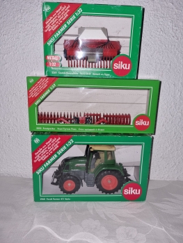Fendt 412 mit Frontpacker und Sähmaschine